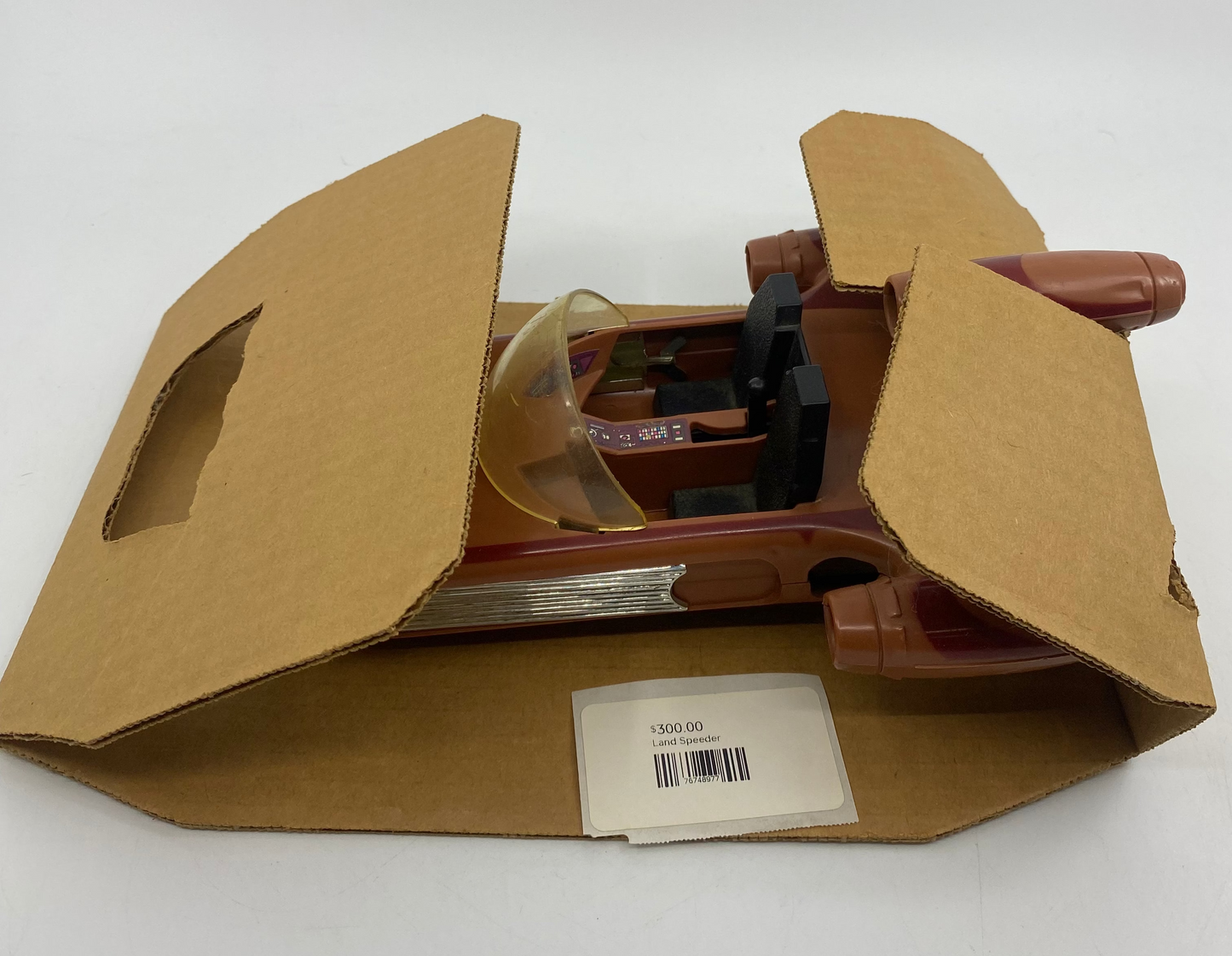 Cardboard box with a plastic component on a white background