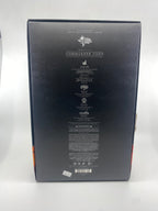 Back view of a toy figure packaging with branding and product details on a white background