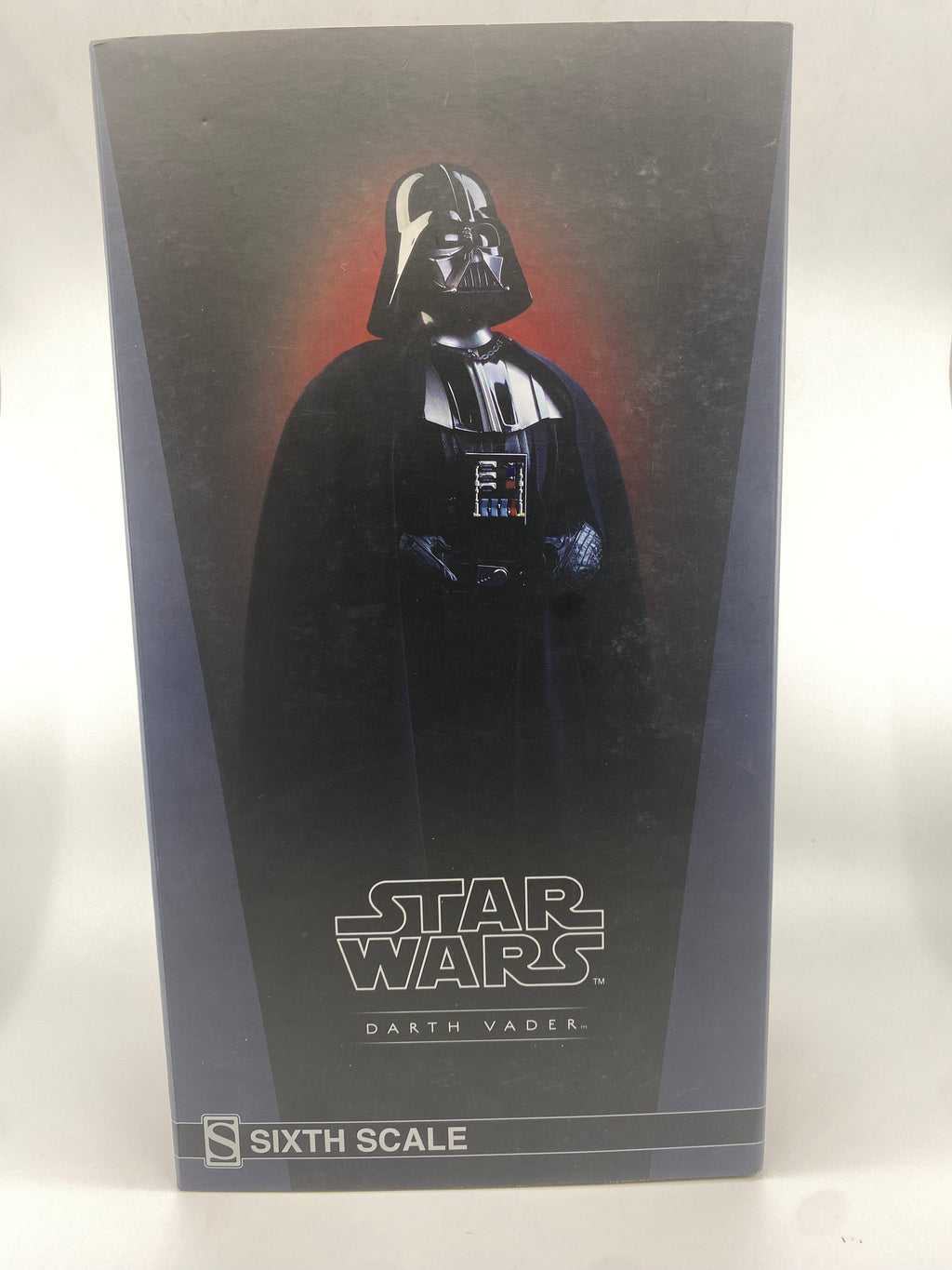 Darth Vader figure in packaging with Star Wars logo