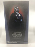Darth Vader figure in packaging with Star Wars logo
