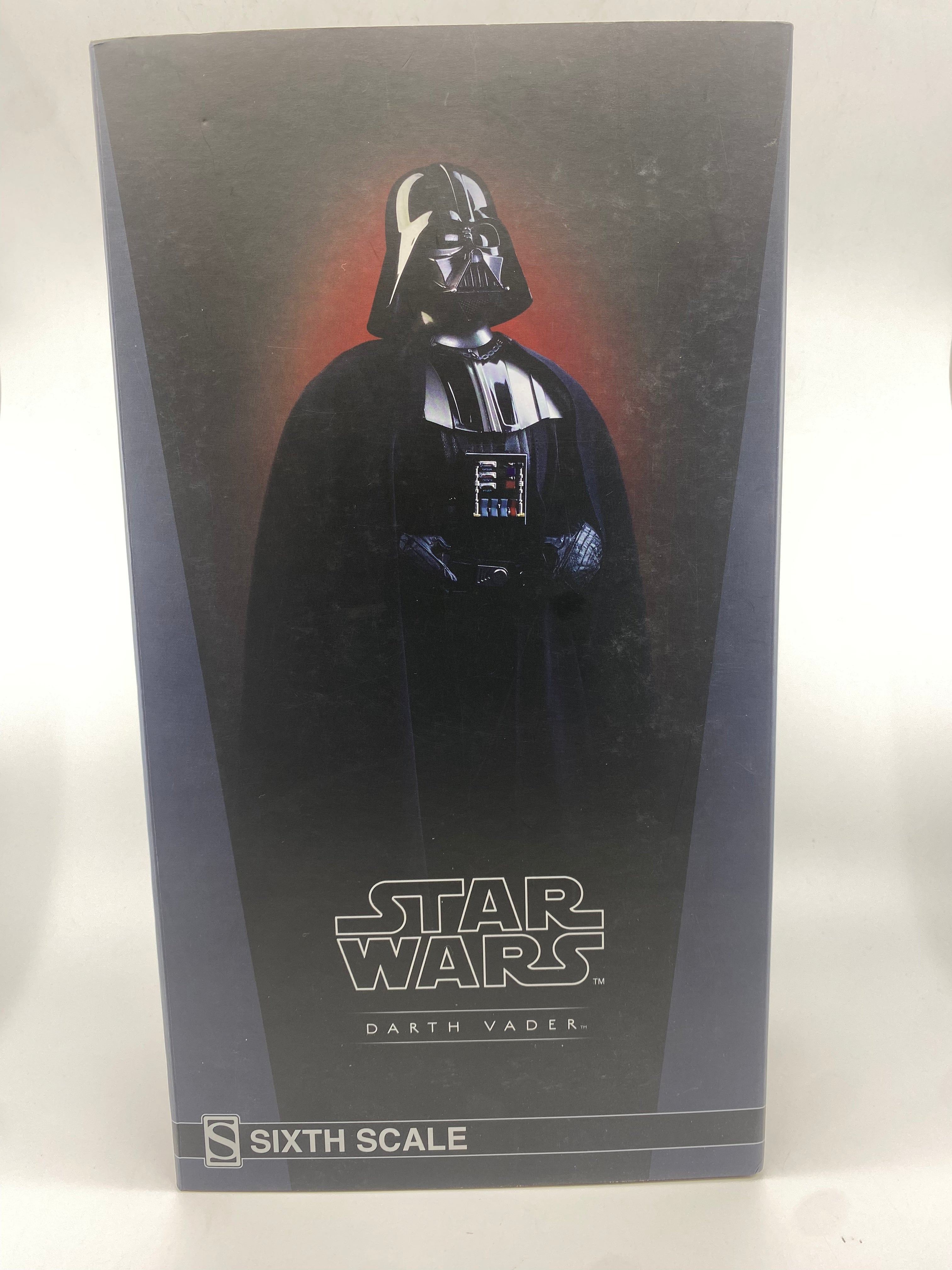Darth Vader figure in packaging with Star Wars logo