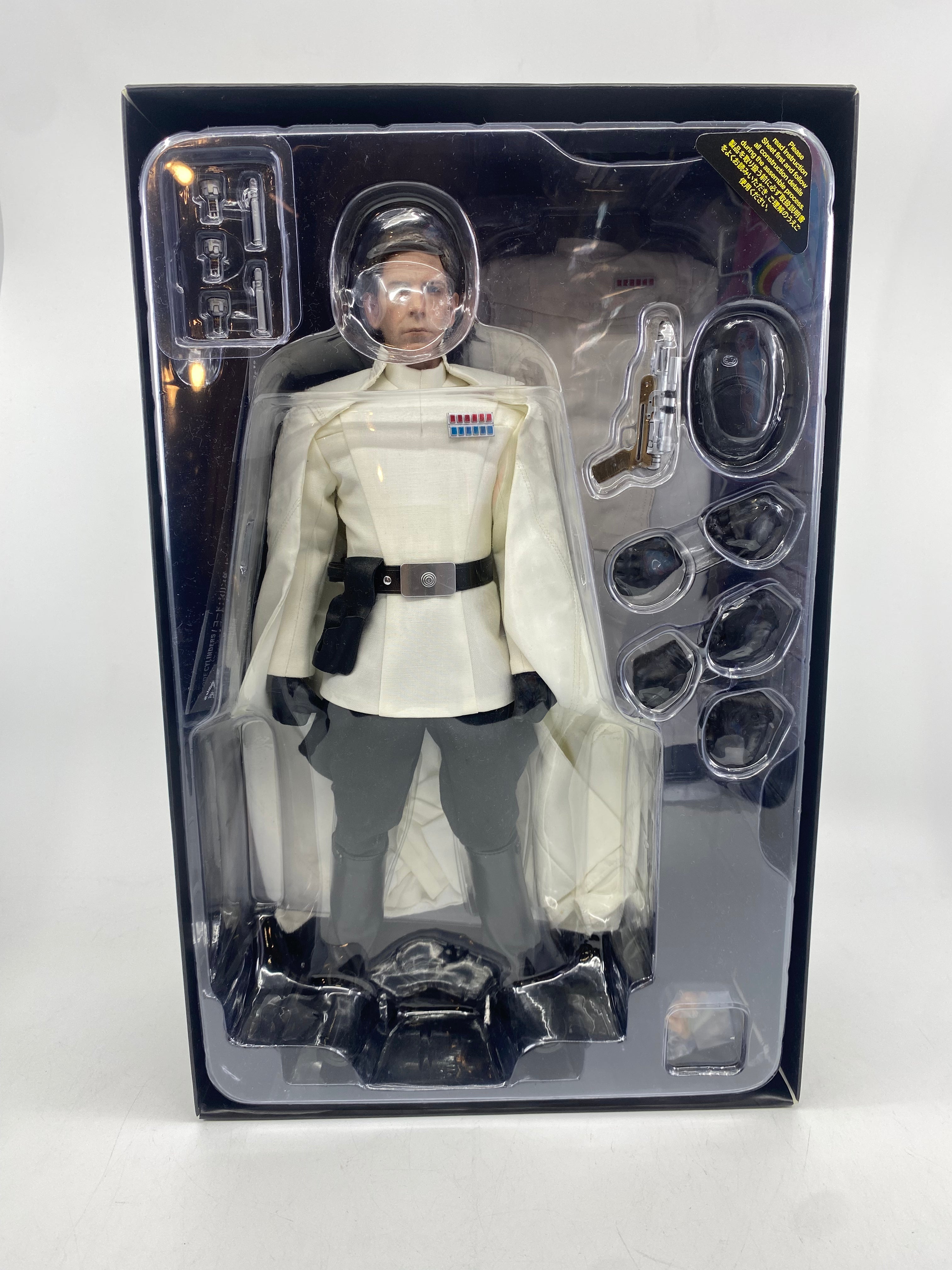 Action figure in a clear packaging with black border on a white background