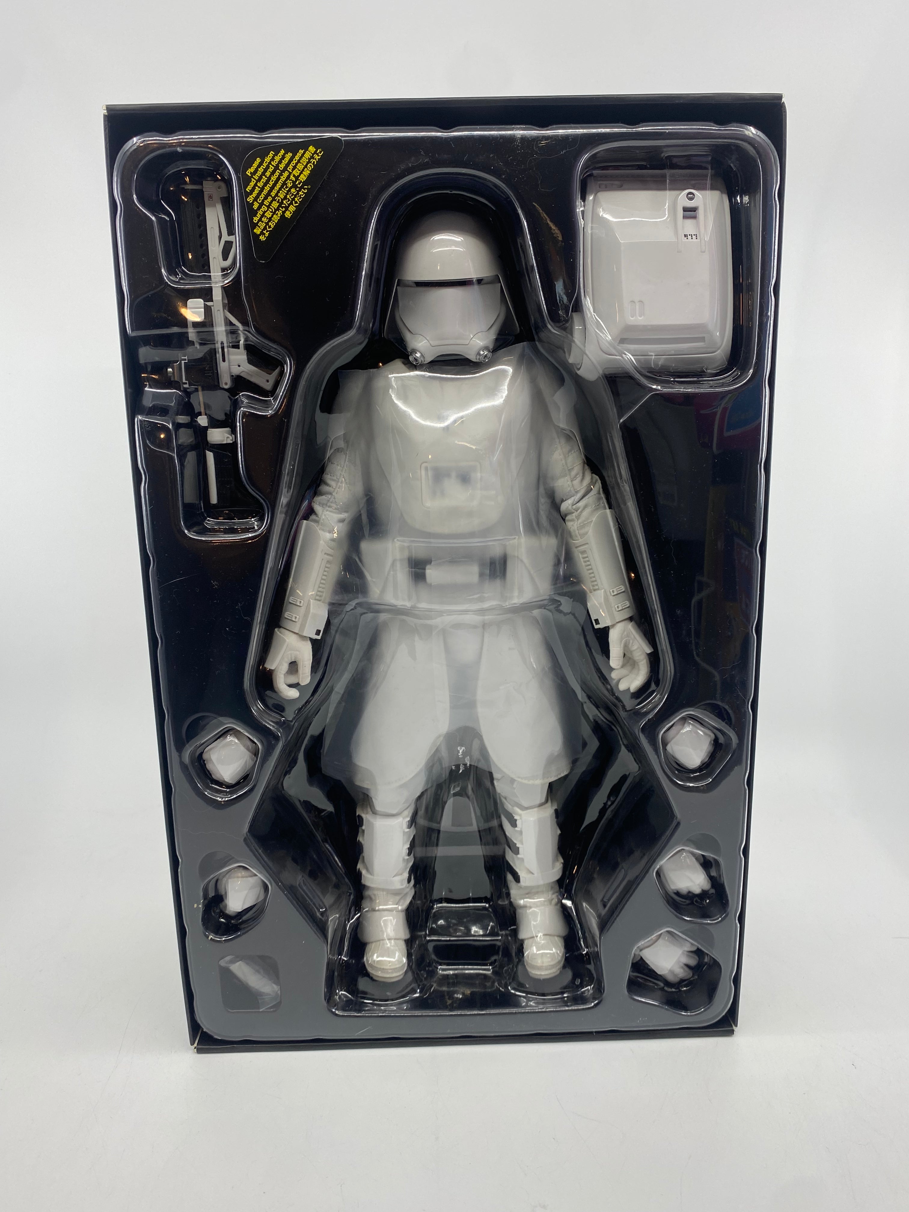 Action figure in clear packaging on a white background