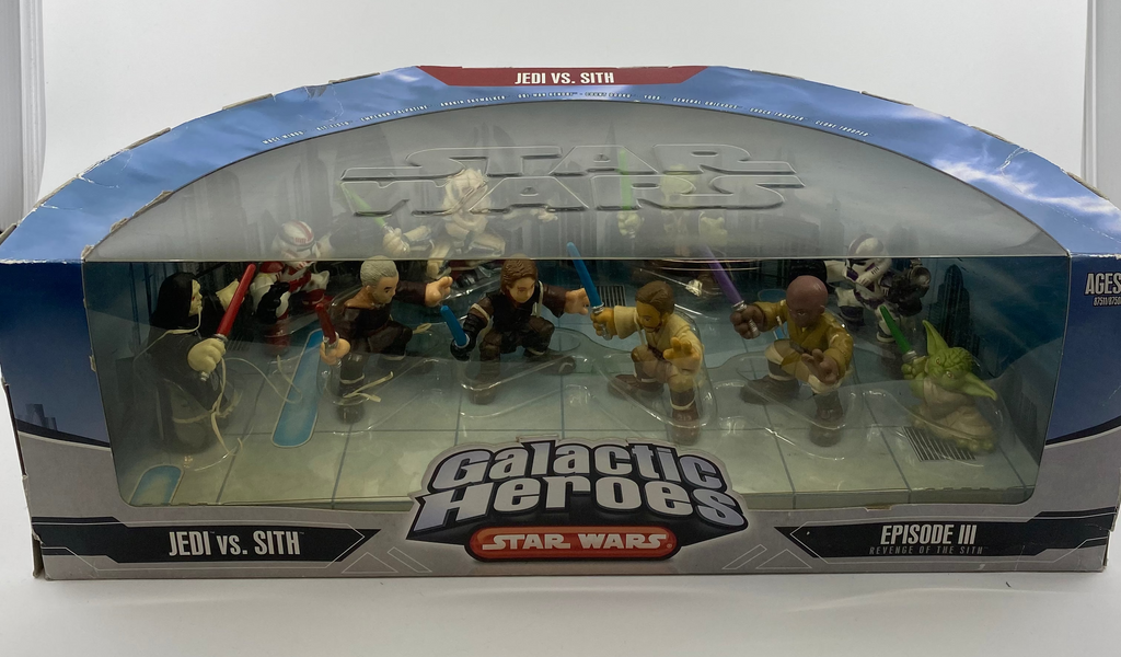 Box of 'Galactic Heroes Star Wars Jedi vs. Sith' figures on a white background