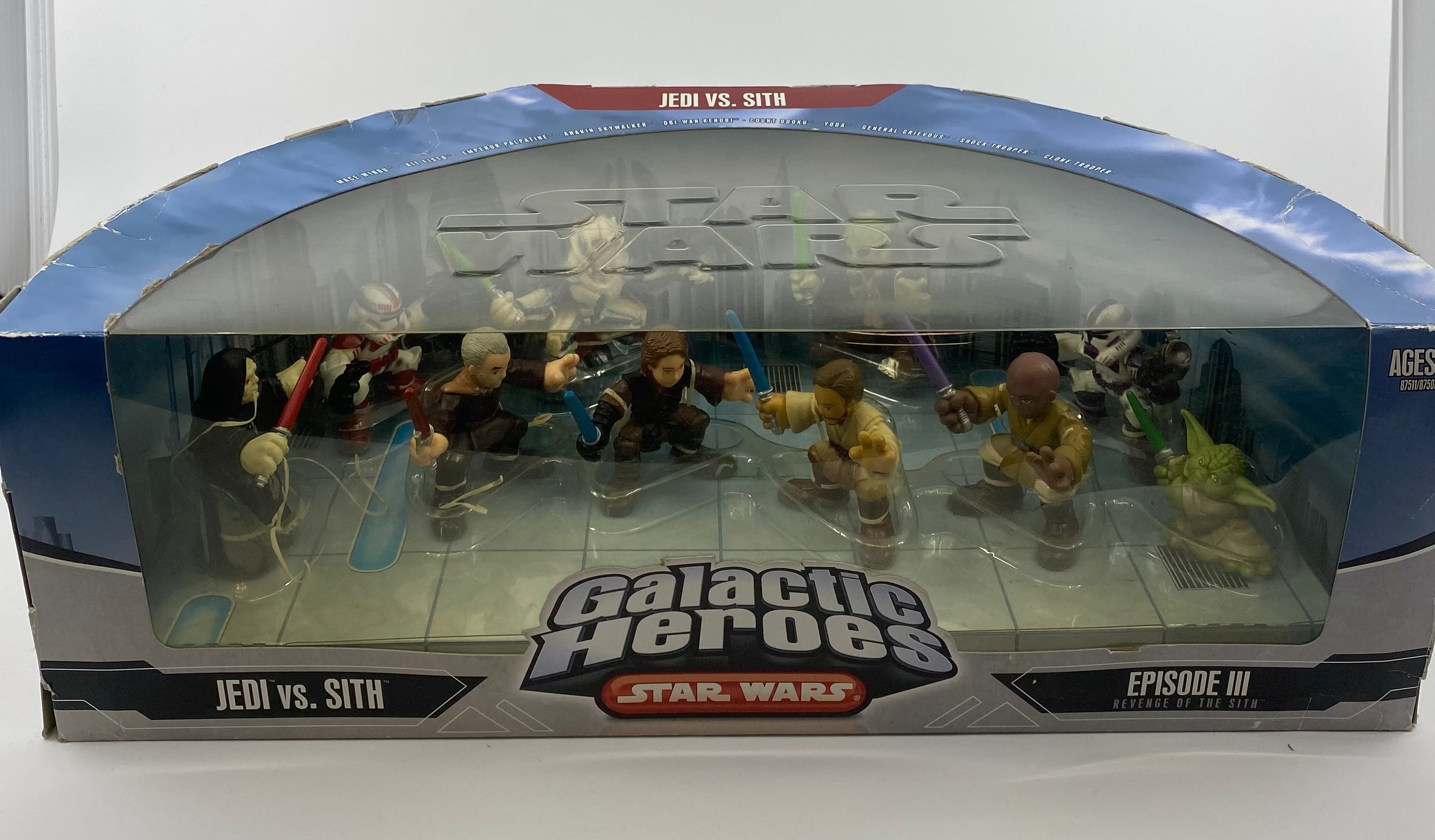 Box of 'Galactic Heroes Star Wars Jedi vs. Sith' figures on a white background