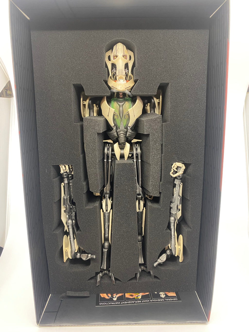 Mechanical figure in a display case with a white background
