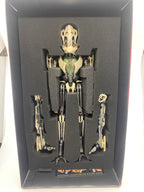 Mechanical figure in a display case with a white background