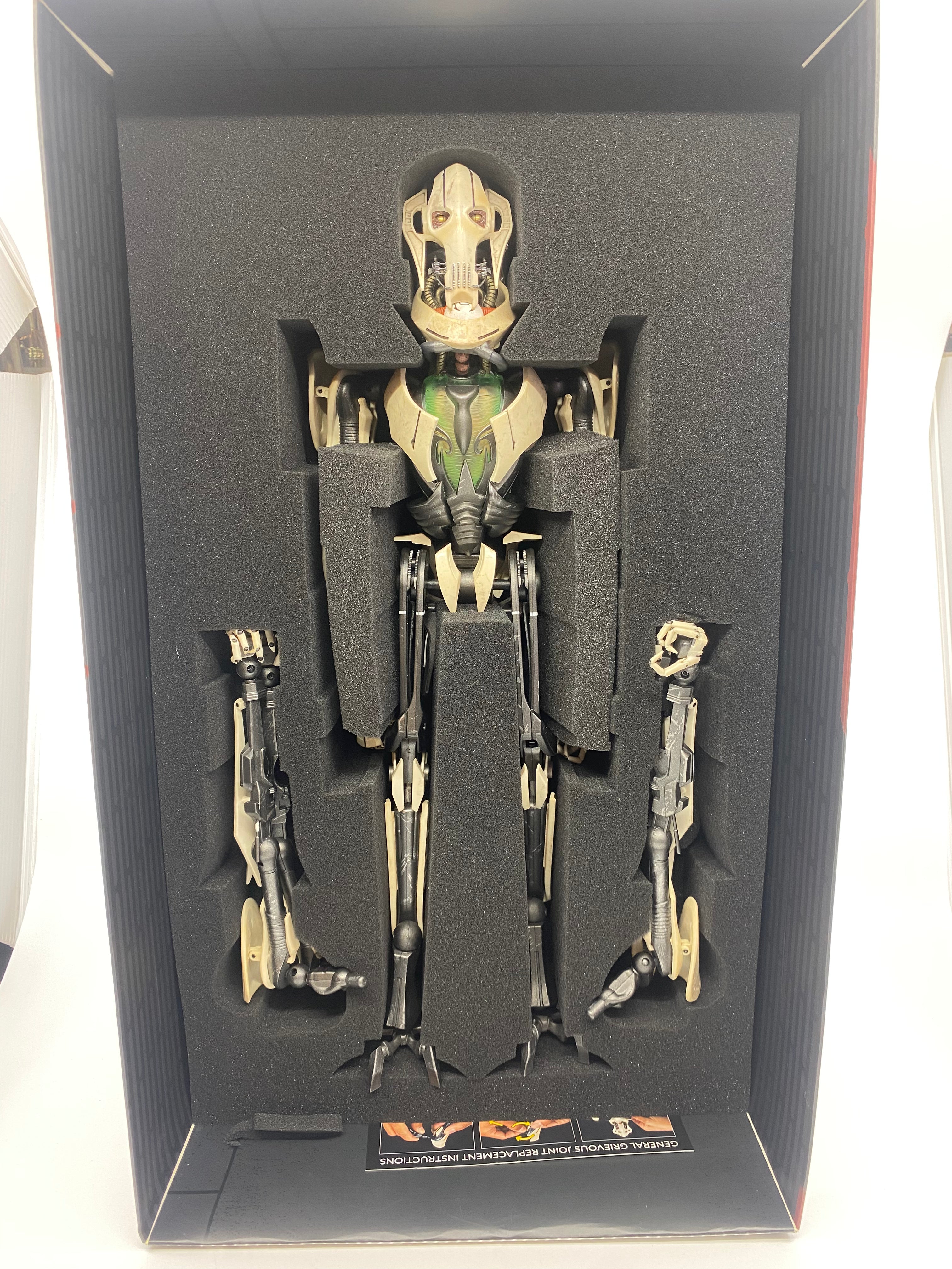 Mechanical figure in a display case with a white background