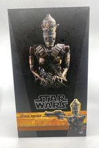Star Wars toy figure packaging with robot design on a black background