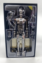 Robot toy figure in clear packaging on a white background