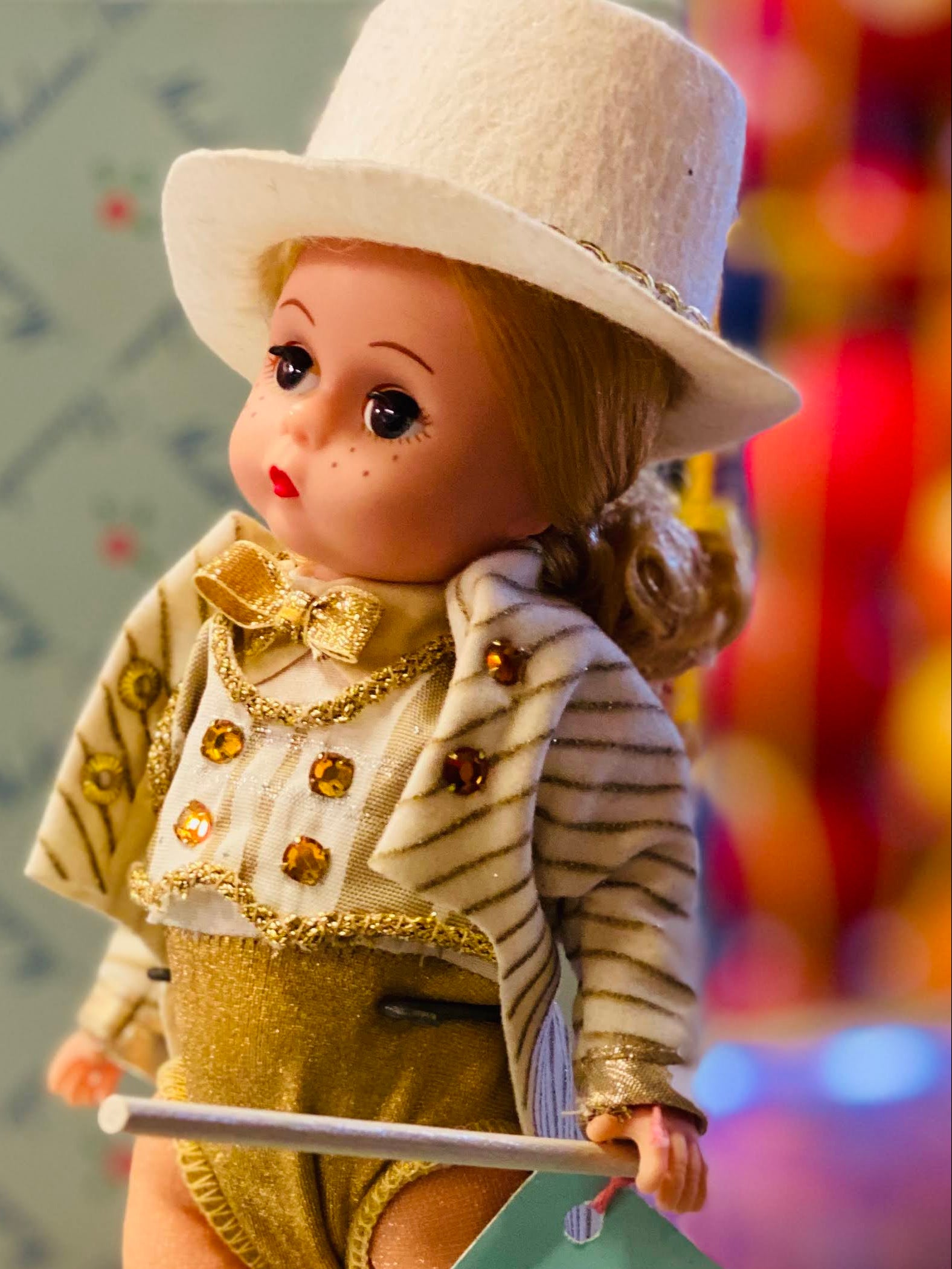 Vintage-style doll in a tap dancer outfit with a 'Wendy Tap Dancer' tag, set against a colorful background.