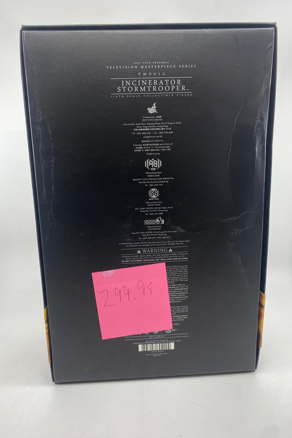 Back of a product box with text and a pink sticky note on a white background