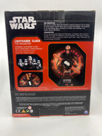 Star Wars Lightsaber Clock packaging with character images and text on a white background