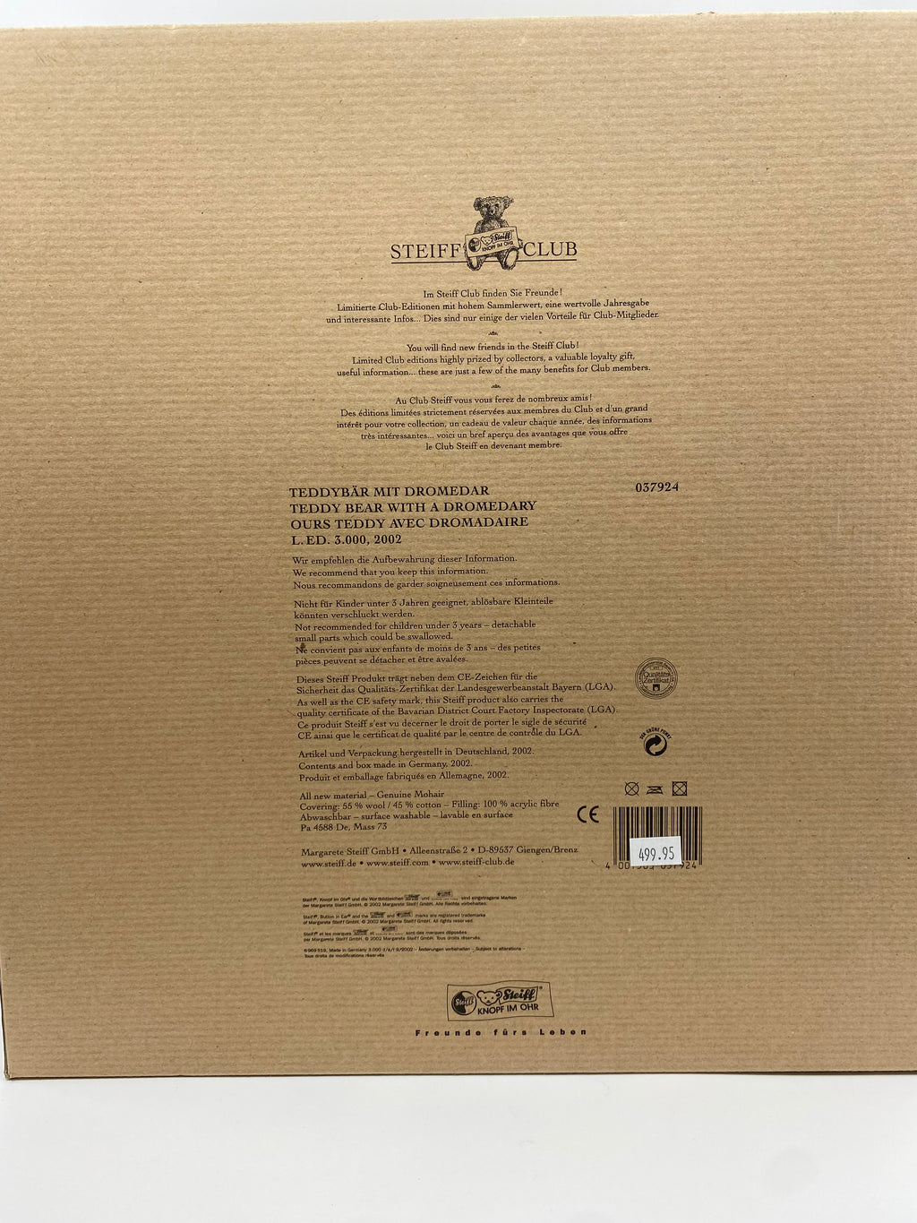 Back of a cardboard box with text and branding, featuring 'Steiff Club' on a beige background.