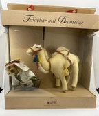 Stuffed teddy bear and camel set in a decorative box with text 'Teddybär mit Dromedar'.