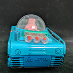 Toy robot with a transparent dome on a dark background
