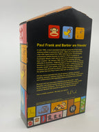 Back view of a product packaging featuring Paul Frank and Barbie logos with text.