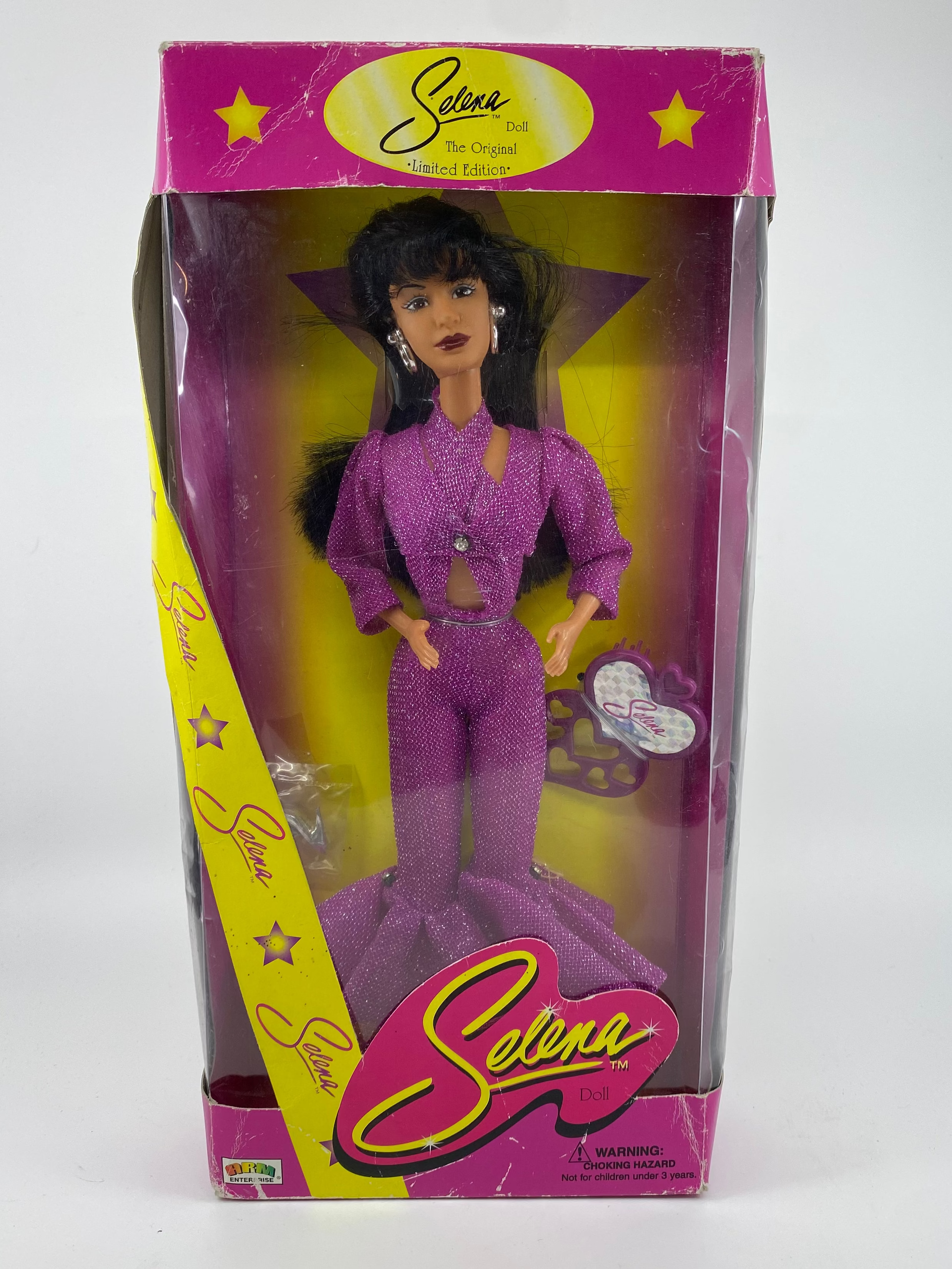 Setena doll in packaging with purple outfit on a white background