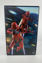 Star Wars action figure packaging with two red-clad characters on a dark background