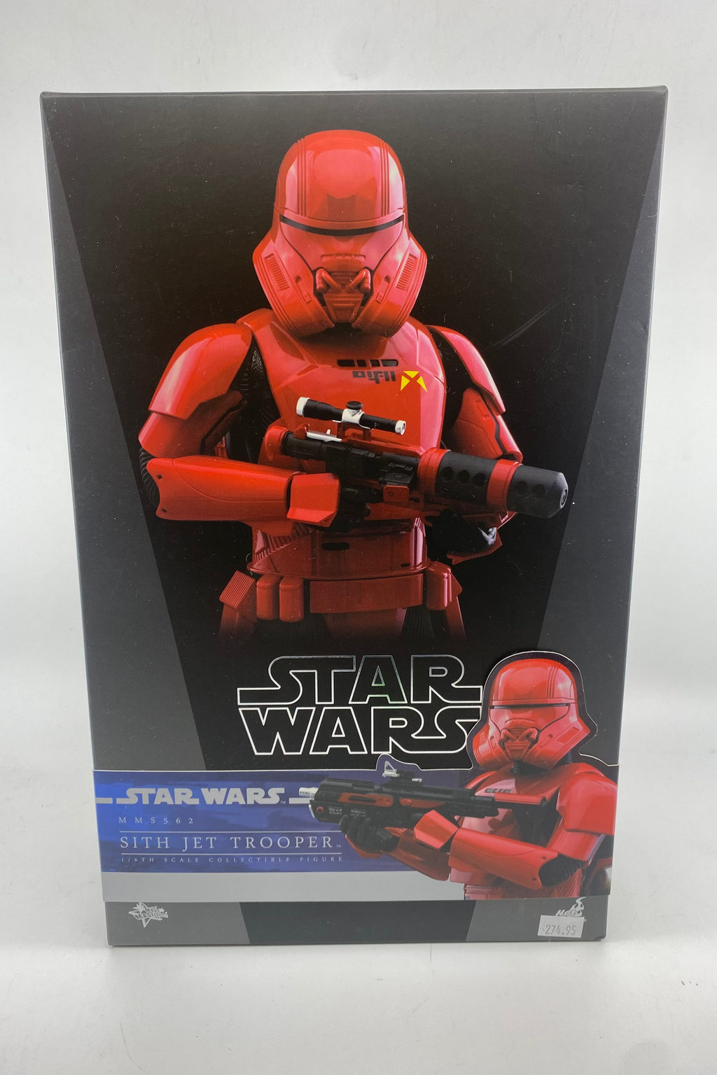Star Wars toy figure packaging with red stormtrooper design on a gray background