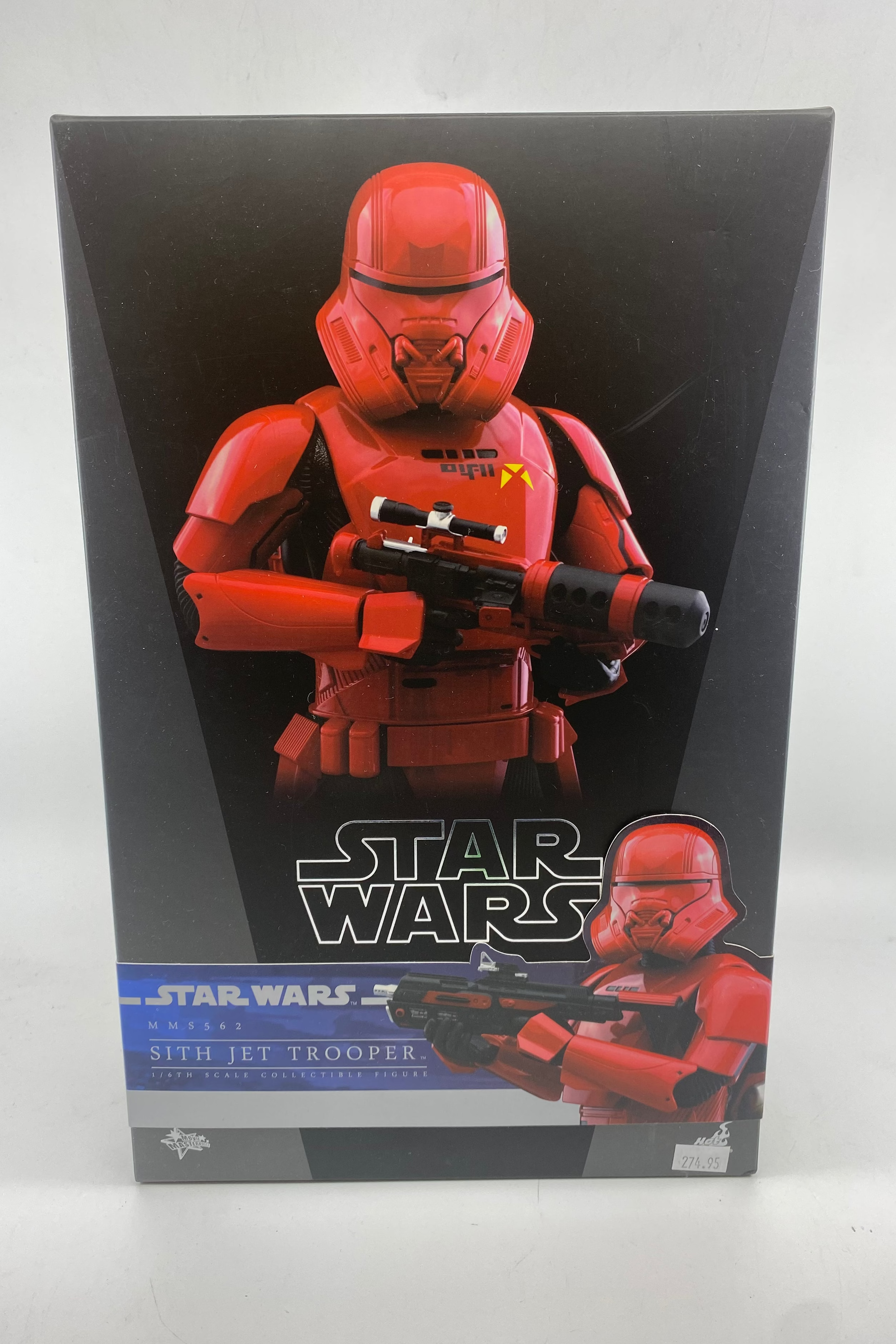 Star Wars toy figure packaging with red stormtrooper design on a gray background