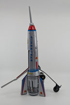 Model of a spaceship with a gray body, red accents, and a white background