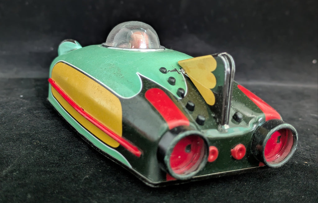 Toy car with a retro design on a dark background