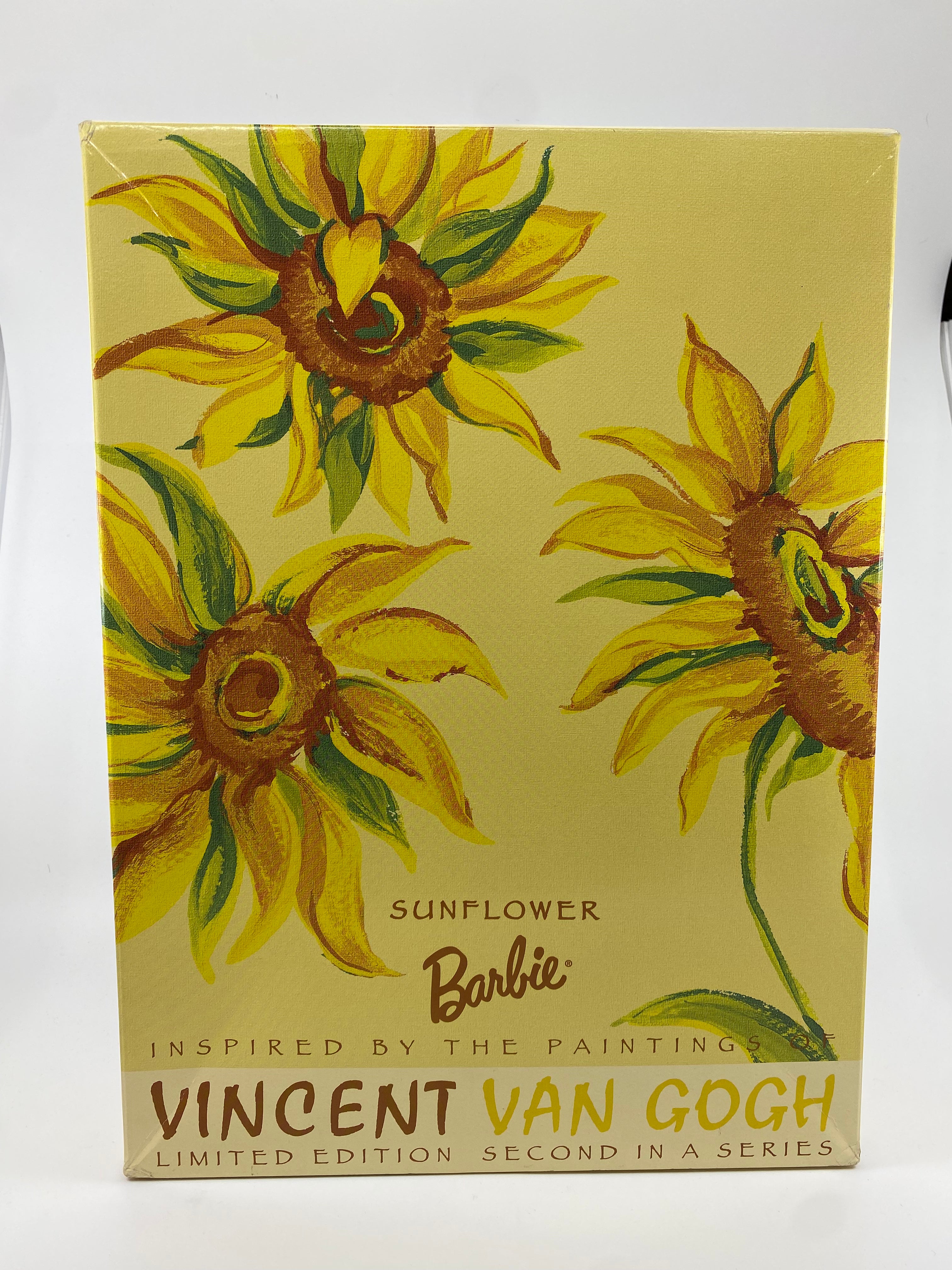 Barbie doll box with sunflower design inspired by Vincent van Gogh on a beige background