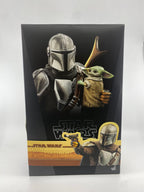 Product packaging for 'The Mandalorian' and 'The Child' from Star Wars with characters holding a gun.