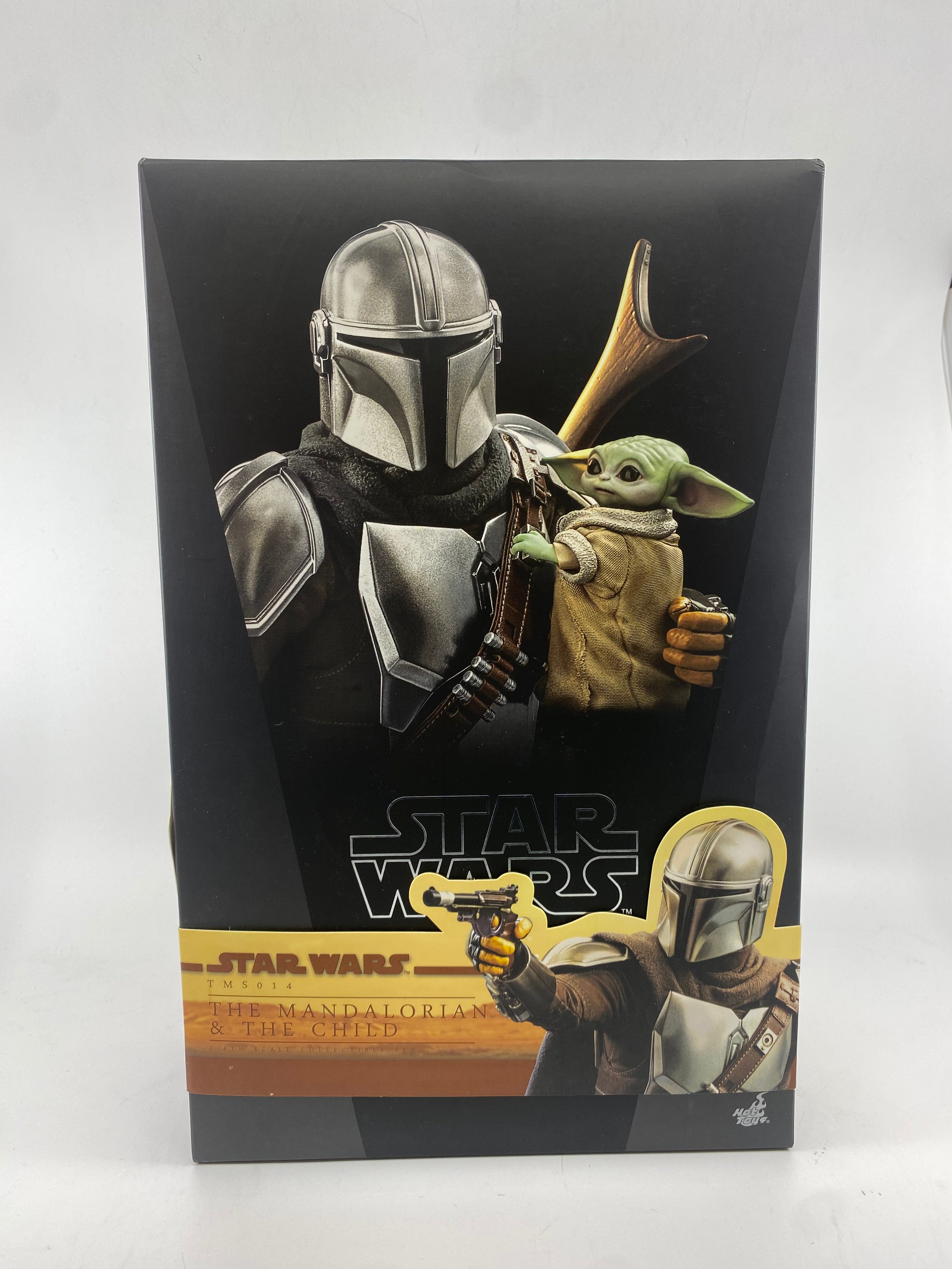 Product packaging for 'The Mandalorian' and 'The Child' from Star Wars with characters holding a gun.