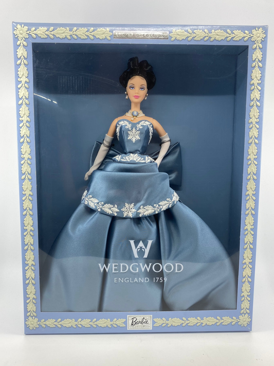 Barbie doll in a blue gown with silver embellishments, displayed in a Wedgwood box.