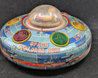 Vintage toy space explorer ship on a black background