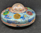Colorful vintage toy with a transparent dome on a dark background
