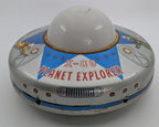 Toy resembling a UFO with 'X-80 Planet Explorer' text on a white background