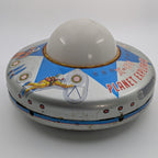 Toy UFO with 'Planet Explorer' text on a white background