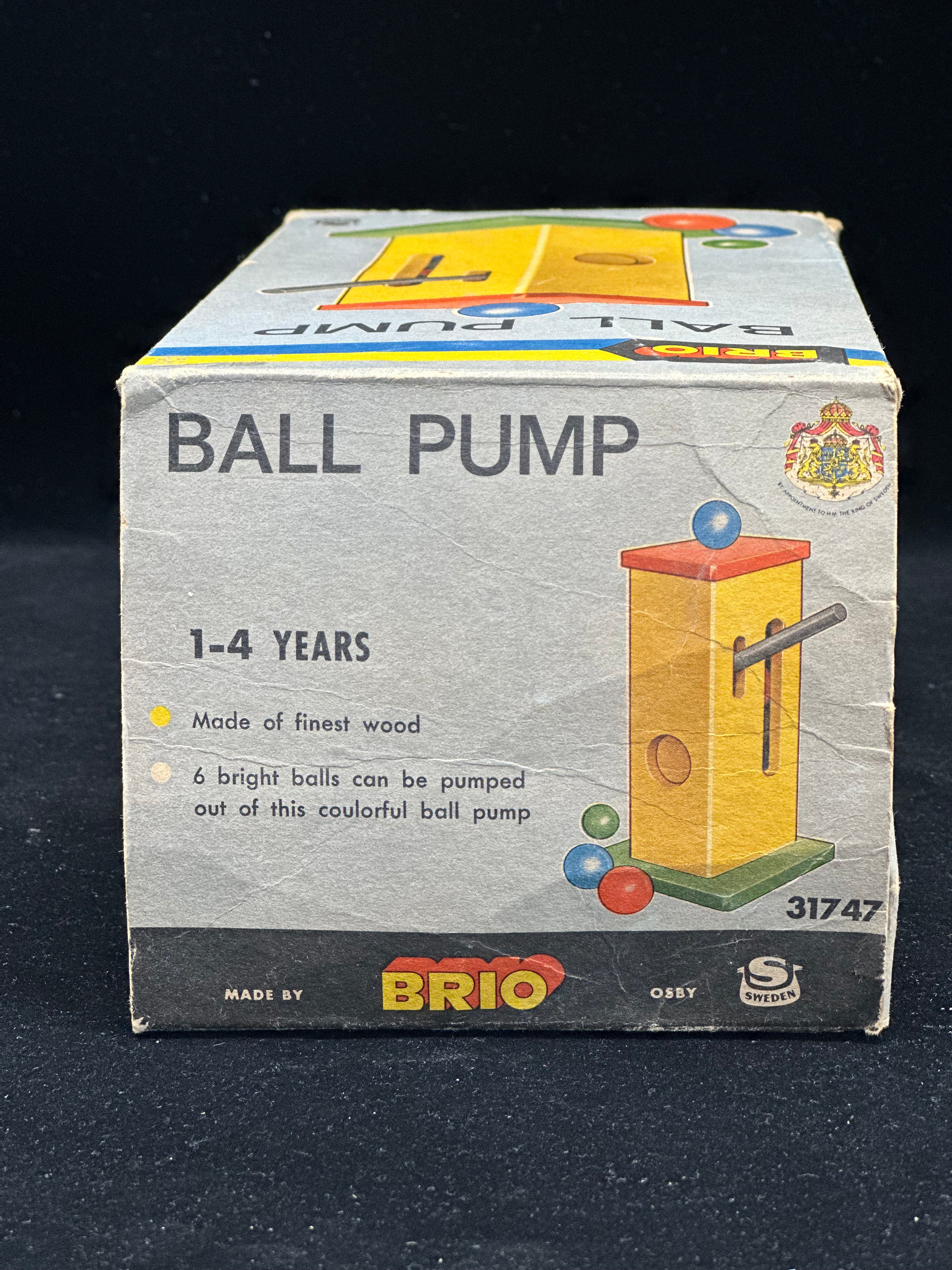 Box of a Brio ball pump toy for children on a black background