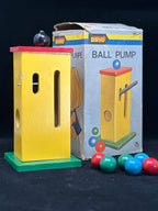 Brio ball pump toy with colorful balls and packaging on a dark background
