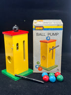 Brio ball pump toy with colorful balls and packaging on a dark background