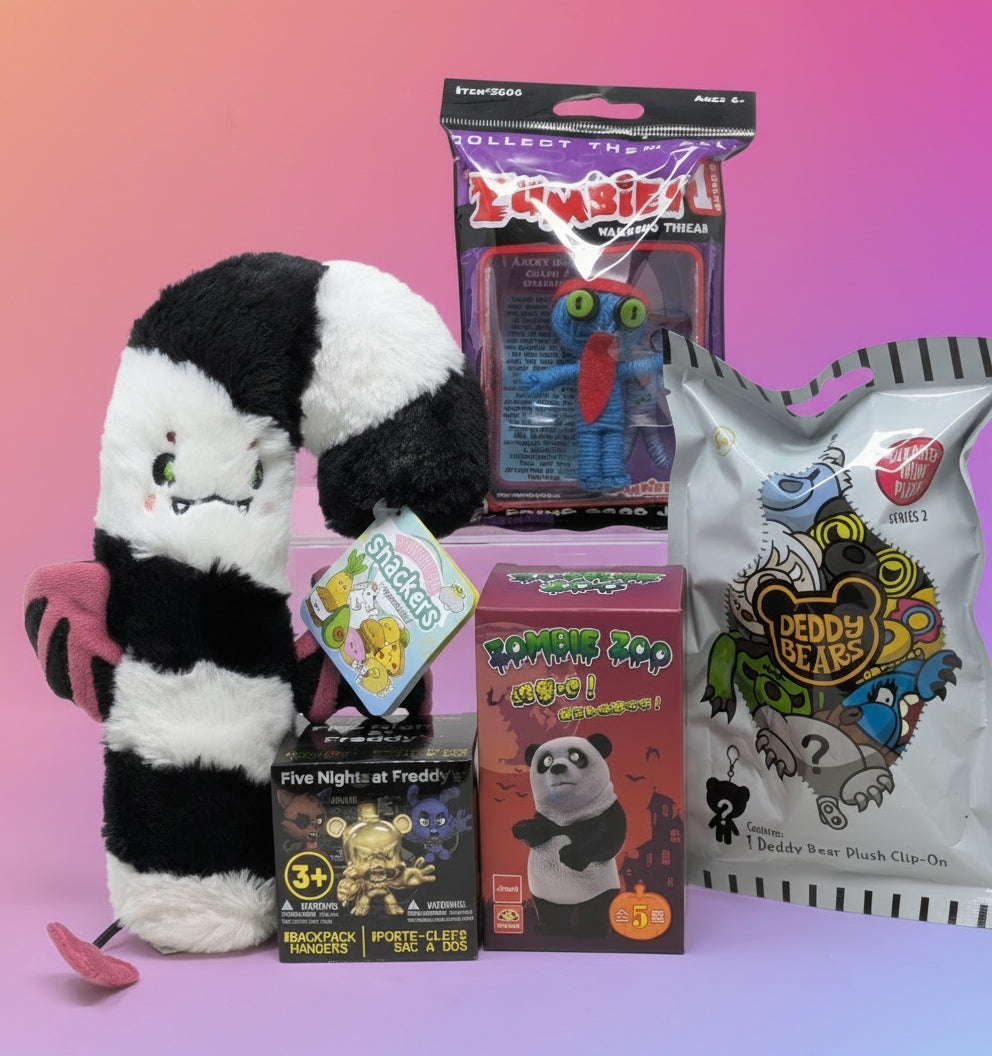 Collection of creepy-themed products including a plush toy, boxes. Deddy Bear, Five Nights at Freddy's, Snackers. 