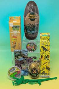 Assorted  dinosaur puzzles and toys 