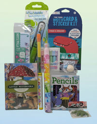 Assorted stationery items including notebooks, pencils, and notecard kits 