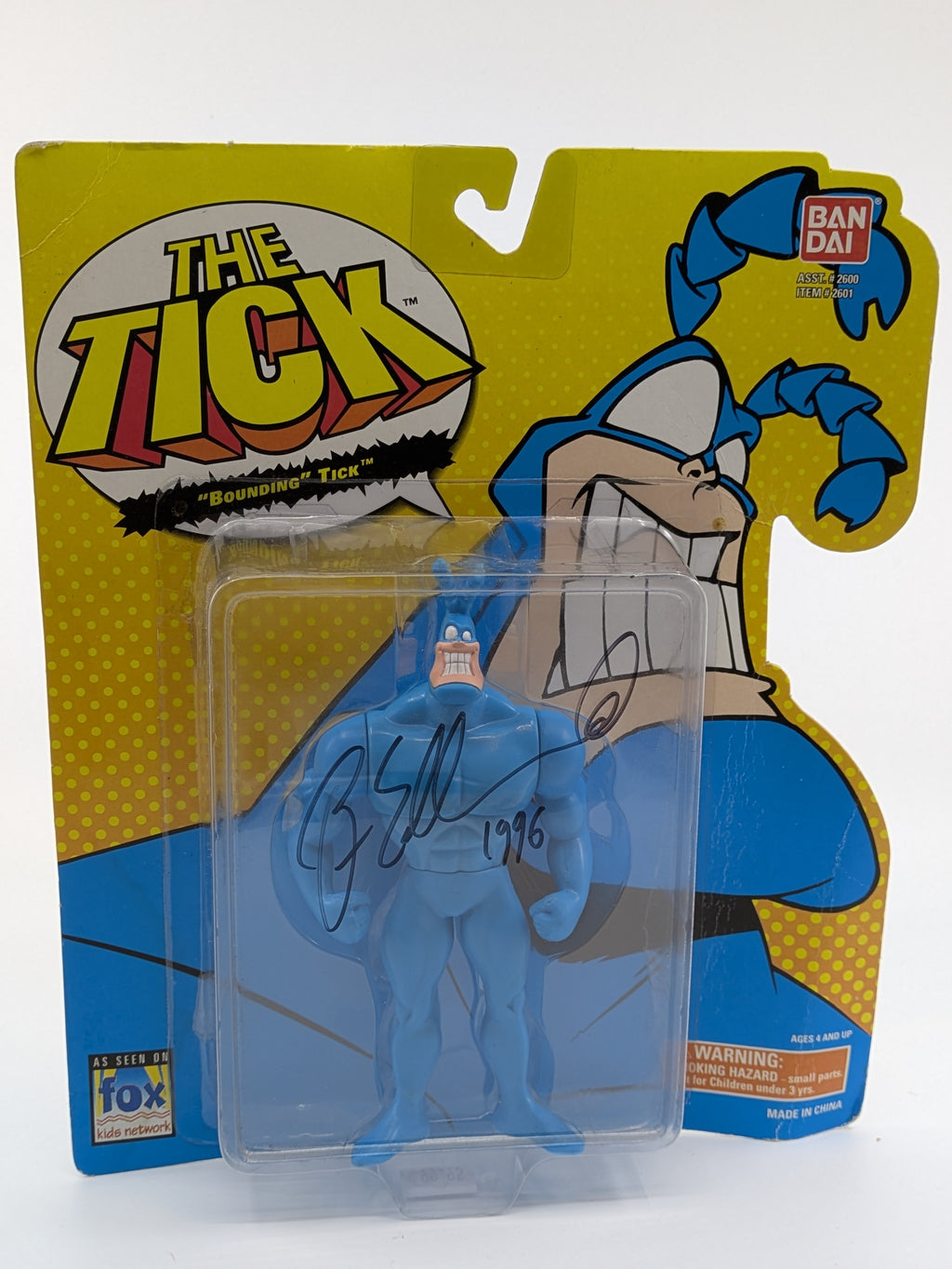  Signed 'Bounding' Tick action figure by Ben Edlund, packaged in its original card with The Tick artwork, vintage 1994 Bandai product.